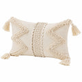 Cojín decorativo rectangular 50 x 30 cm beige de tejido texturizado con borlas estilo bohemio